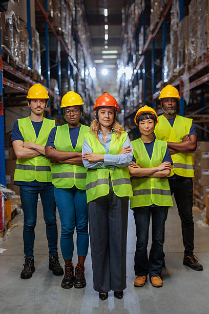 istock Team of warehouse workers posing for a photo 2230231954