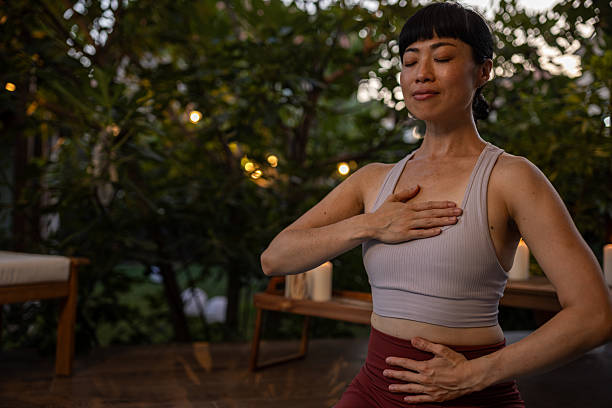 istock Japanese woman doing relaxing meditation exercise 2230235401