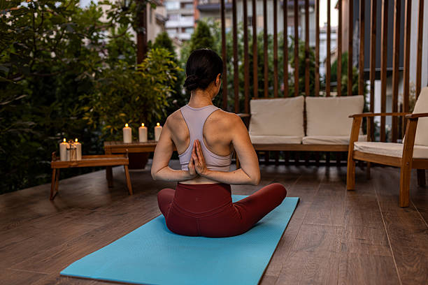 istock Japanese woman meditating on terrace 2230235438