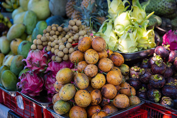 Bali, Indonesia Exotic Balinese fruit like spike fruit for sale at a market stand.