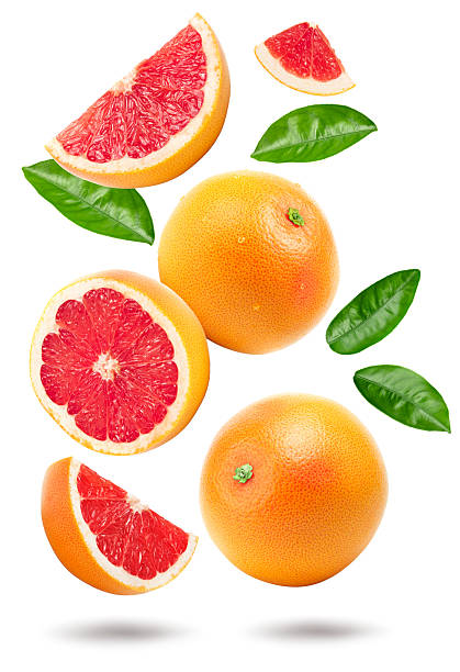 istock grapefruit with slices and green leaves isolated on white background top view. clipping path 2230236997