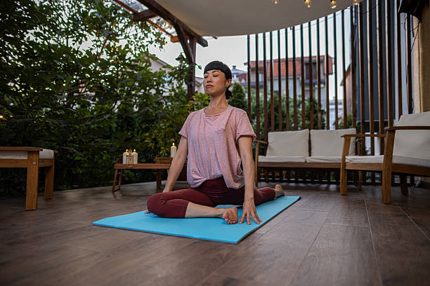 istock Japanese woman meditating on terrace 2230237907