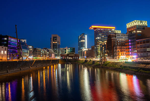 istock Media Harbour Duesseldorf at Night shining bright 2230241413