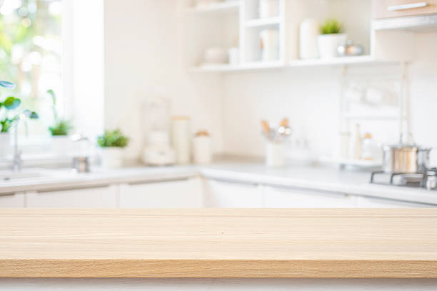 istock Wooden texture table with bright interior of kitchen as blurred background 2230245347