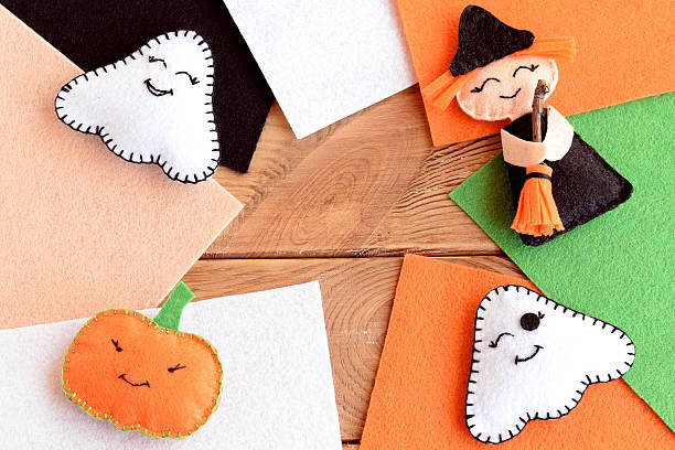 istock Halloween cute felt DIY. Homemade small witch with broom, pumpkin head, two ghosts 2230248120