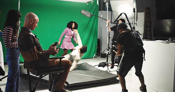 istock People, acting and filming with stabilize in studio for commercial, production process and record. Crew, actor and actress with cameraman on set for shooting scene, action movie and rehearsal footage 2230248689
