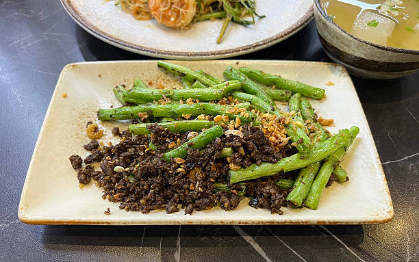 istock Stir-fried green beans with minced pork and salted black beans 2230252271
