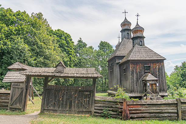 istock Rustic, ancient wooden Orthodox church in a rural Central European setting The structure has multiple steeples and a prominent metal cross Earthy tones dominate the muted color palette, with long s 2230254937