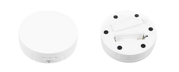 istock A white rotating display stand for product photography, with a USB port. 2230268552