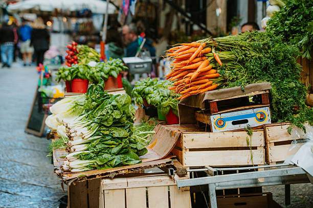 istock Fresh Vegetables Displayed at Local Market Stall in Vibrant Outdoor Setting 2230270939