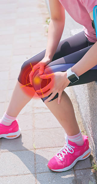 istock female running knee pain 2230271229