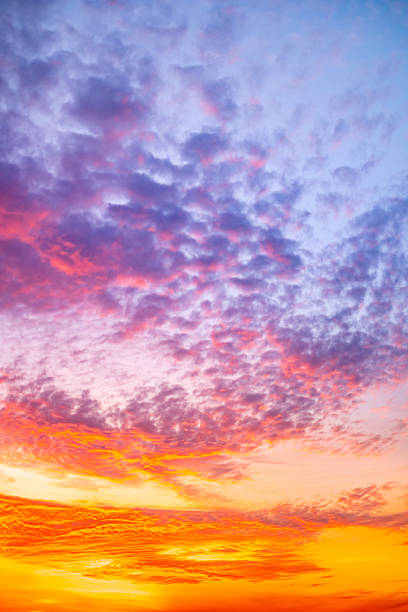 istock Beautiful , luxury soft gradient orange gold clouds and sunlight on the blue sky perfect for the background, take in evening,Twilight, Large size, high definition landscape photo,Vertical 2230272702