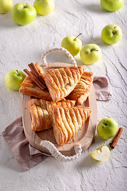 istock Sweet apple triangle cake served in sunny kitchen. 2230272768
