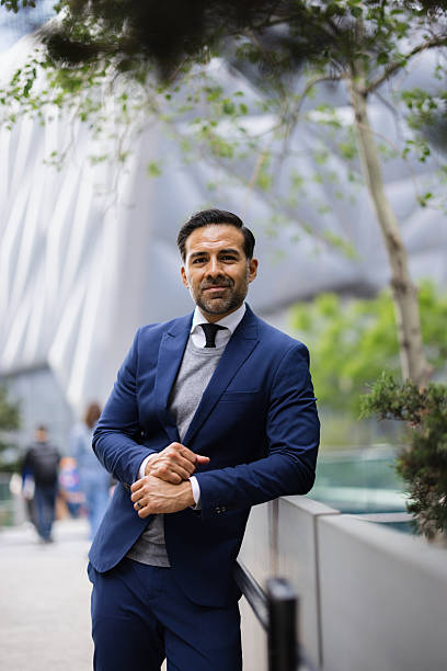 istock Confident businessman posing in a modern city setting 2230273520