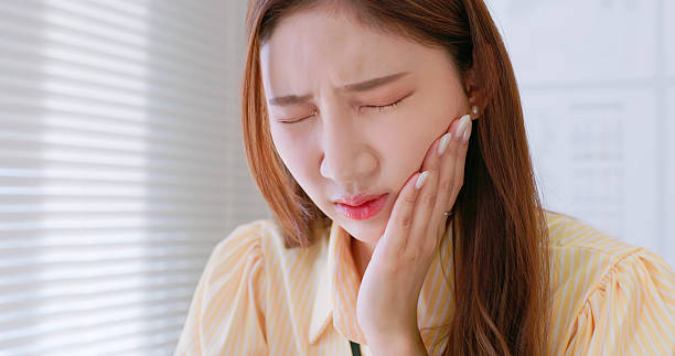 istock businesswoman has toothache 2230276592