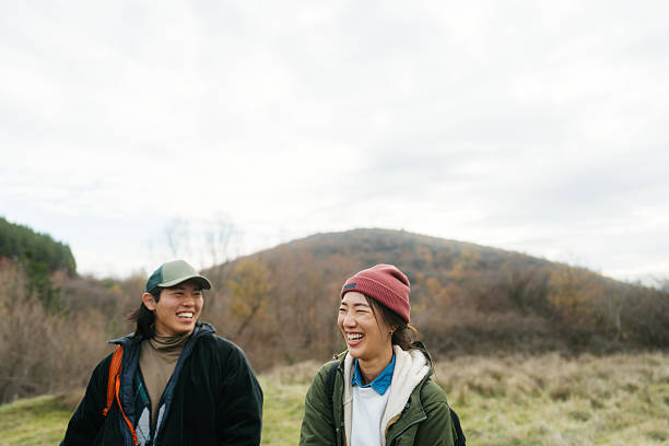 istock Asian couple on a hiking adventure 2230276969