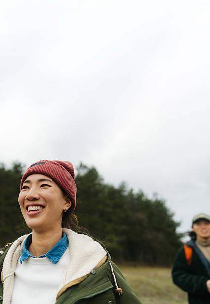 istock Asian couple on a hiking adventure 2230277011