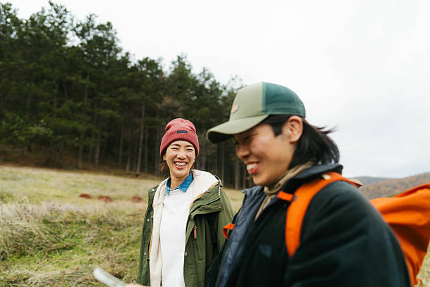 istock Asian couple using mobile phone to plan a hiking route 2230277015