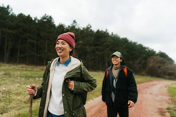 istock Asian couple on a hiking adventure 2230277039