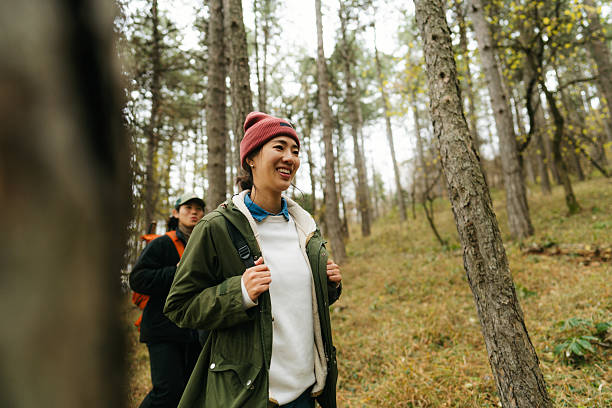 istock Asian couple on a hiking adventure 2230277041