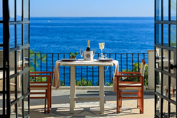 istock Terrace dining table by the sea 2230280313