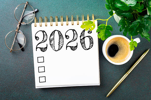 istock New year resolutions 2026 on desk. 2026 resolutions list with notebook, coffee cup on table. Goals, resolutions, plan, action, checklist concept. New Year 2026 template 2230281154