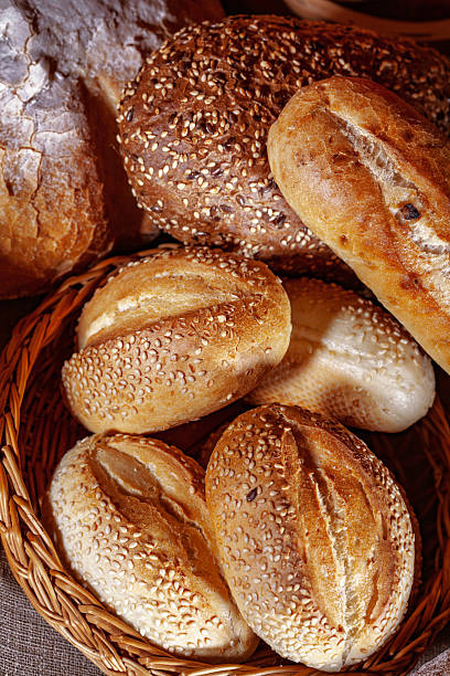 istock Fresh baked bread. Assorted bakery products loafs of bread and rolls... 2230284921