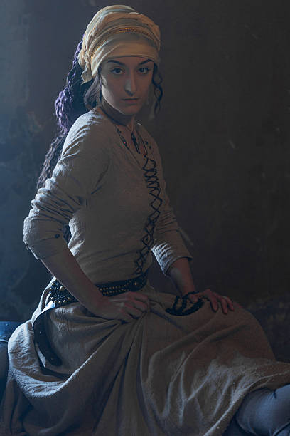 istock Mysterious medieval witch in gypsy-style costume, alluring and powerful . 2230286480