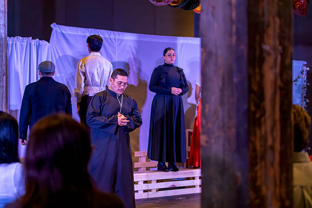 istock Young actor playing a priest in a play 2230291857