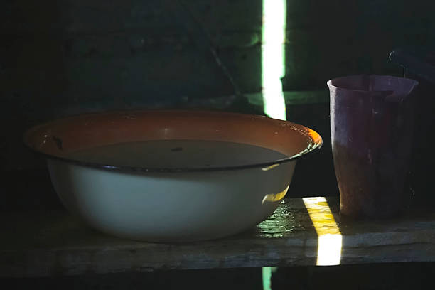 The basin and jug in the bath are old. on the bench