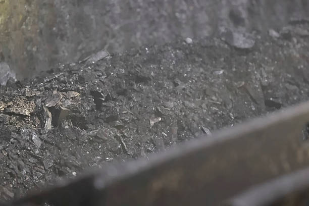 Small stones and coal crumbs of anthracite coal scattered