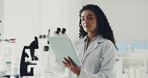 istock Science, research and woman in lab, tablet and innovation with experiment, app or studying results Medical, scientist or person with digital tech, database or breakthrough with healthcare or internet 2230295402