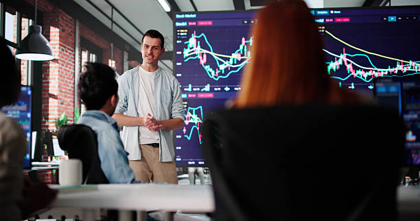 istock Man Presenting Stock Trading Training On TV 2230296005