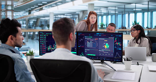 istock Diverse Team Of Stock Brokers Analyzing Market Trends 2230296088