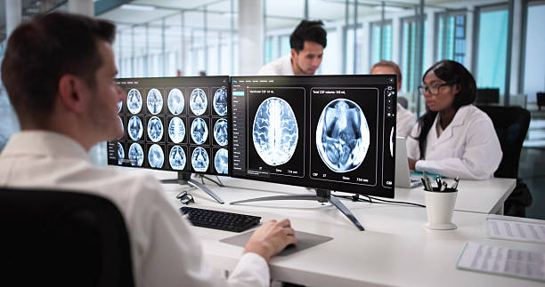istock Doctors Carefully Studying MRI Scans 2230296156