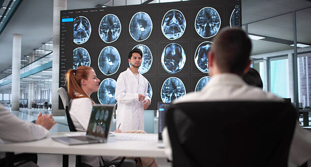 istock Diverse Medical Team Analyzing MRI Imaging During Group Meeting 2230296162