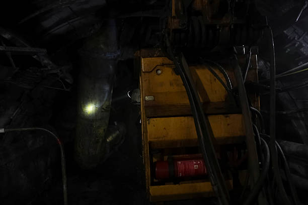 A miner rides in a transport trolley through the mine.