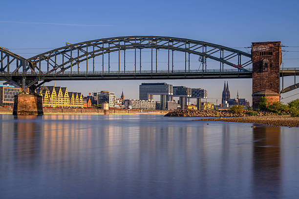 Cologne, Germany - May 12, 2025: Panorama of Cologne city along the Rhine river against morning light on May 12, 2025 in Germany, Europe