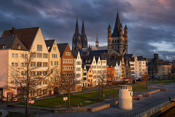 Cologne, Germany - March 10, 2025: Panorama of Cologne city along the Rhine river against morning light on March 10, 2025 in Germany, Europe