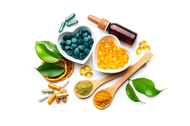 istock Nutritional supplements on white background. Spirulina and Omega-3 pills. Herbal therapy and essential oils. Natural vitamins or healthy eating and dieting. Healthcare or alternative medicine 2230299328