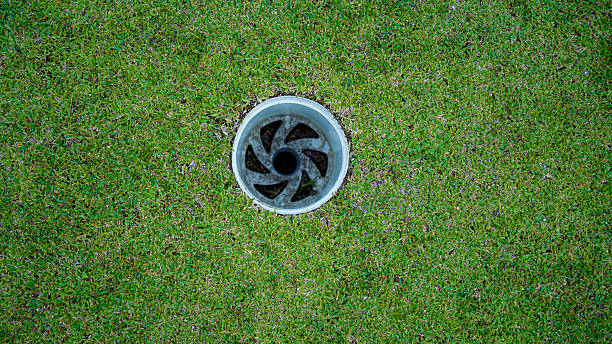 istock Close-up golf hole on a green course. 2230300089