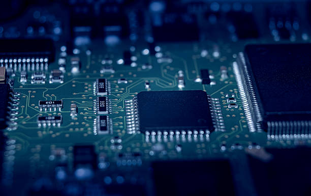 Close-up view of intricate electronic circuit board components in dark setting showcasing technology and innovation