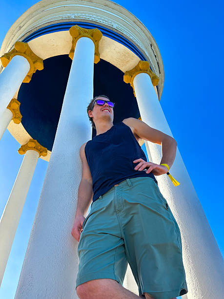 istock A low-angle of a man leaning against a structure outside 2230302748