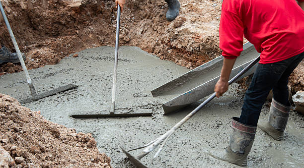 istock Workers are helping to level the concrete floor. 2230302758