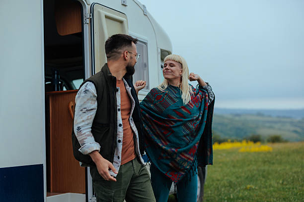 istock Two people coming out of a camper van on a cold spring morning 2230303380