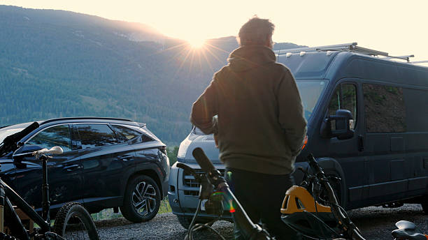 istock Mature man walks by vehicles at sunrise 2230306631
