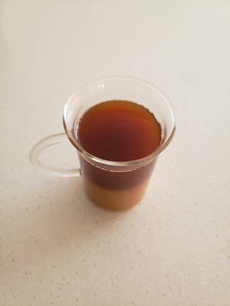 istock Coffee and Creamer Drink in a Transparent Glass Cup 2230308328