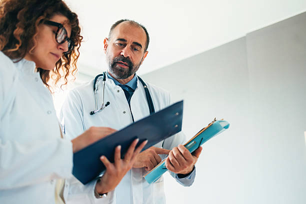 istock Two Doctors Reviewing Documents Together in a Bright Medical Office 2230313903