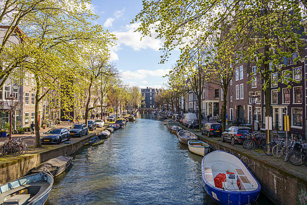 istock Canal in Amsterdam with boats 2230314908