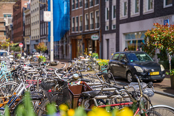 istock bicycles parked in Amsterdam 2230315288